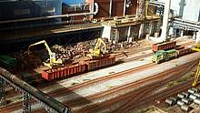 Eines der Highlights der Modellbahn-Anlagen auf der Intermodellbau 2015: Die Anlage der Zeche Otto zeigt ein Stahlwerk im Maßstab 1:87 (H0) nach Vorbildern aus dem Ruhrgebiet. Dargestellt werden die Roheisengewinnung und die Weiterverarbeitung zu Stahl, inklusive der Entstehung von Brammen, Roheisen-Masseln und dem Walzen der Brammen zu den Coils. Durch Lichteffekte, Rauch, Geräusche und pendelnde Züge beginnt diese Anlage zu „leben“